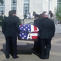 image of casket being carried to the rotunda