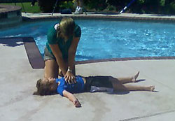 A woman rescues a mock drowning victim