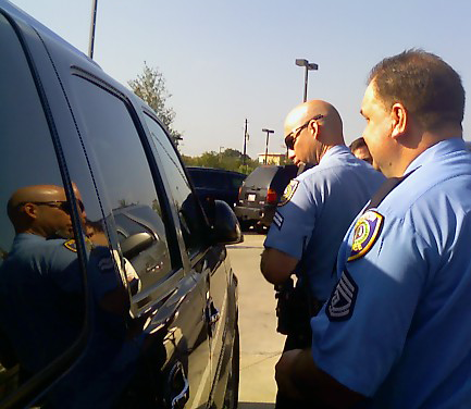 HPD officers checking cars