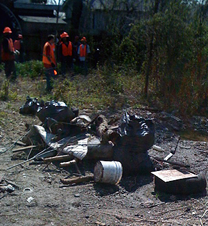 Dumping Trash Crew cleaning up lot