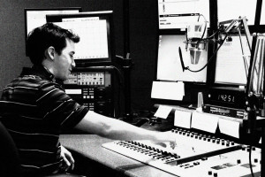 Announcer Joshua Zinn sits at the Classical 91.7 controls
