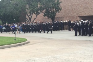 Law enforcement officers gather outside a church for the funeral of Harris Conty Sheriff's Deputy Darren Goforth.