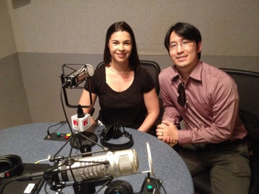 Two Opera in the Heights musicians pose for a photo in a radio studio