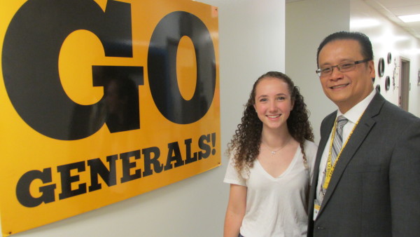 Recent HISD graduate Juliana Dunn stands with Lee High School Principal Jonathan Trinh.