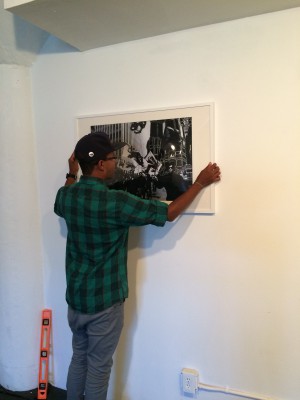 Pyle installing pieces at Fresh Arts for Black Panther Party Power exhibit