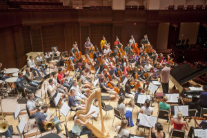 The orchestra rehearses on stage at Rice University