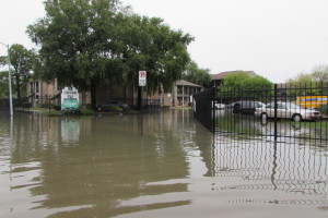 High water floods Fleming Drive in east Houston after torrential rains on Saturday.