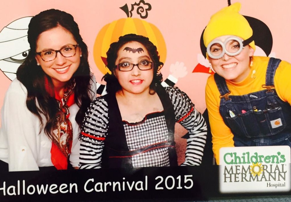 Qirat Chappra (center) celebrates Halloween at a carnival put on by her hospital.