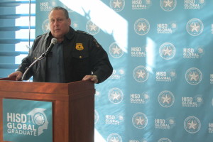 HISD Police Chief Robert Mock stands at a podium and tells reporters that the school system remains on high alert.