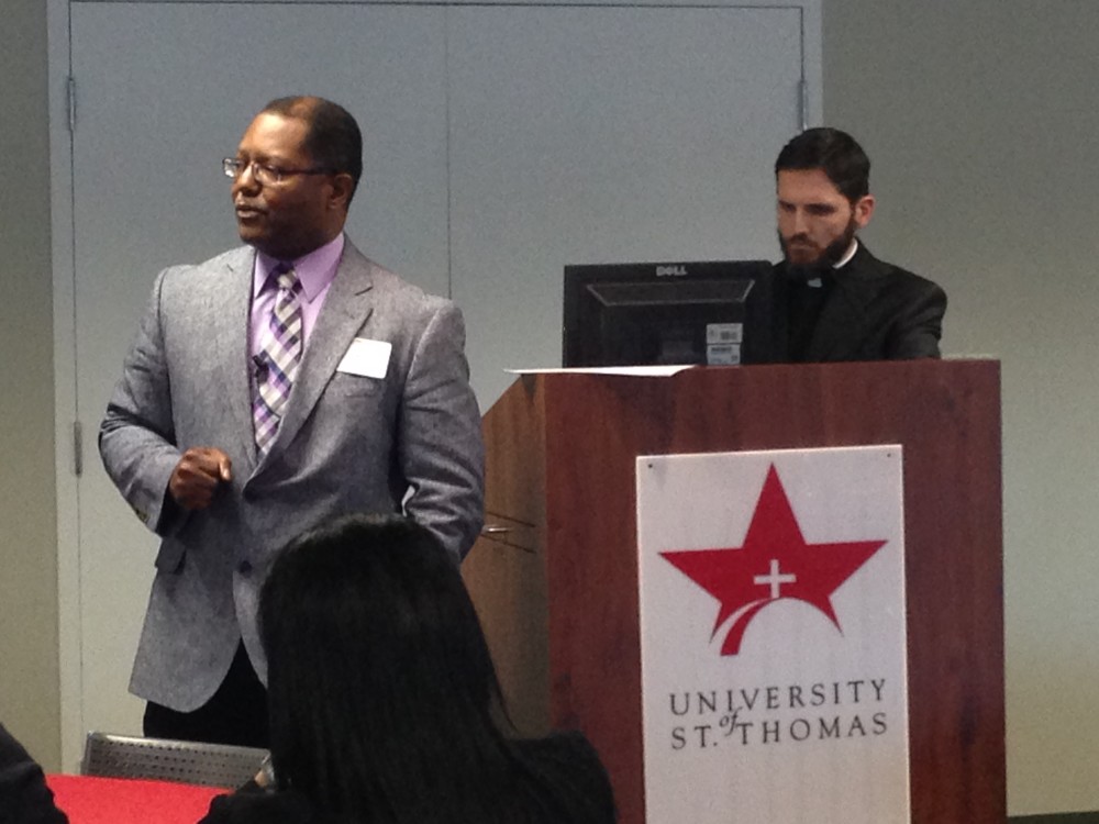 Willie Bennett (left), senior organizer for The Metropolitan Organization, and Father Christopher Plant (right), Pastor at Houston's Resurrection Catholic Community, led a presentation in which they analyzed factors that cause economic disparities in our city.