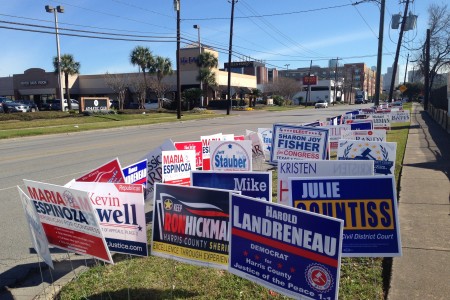 The usual campaign signs were placed next to the entrance to the Metropolitan Multi-Service Center, located in Midtown Houston, which is one of the 42 locations for early voting in Harris County.