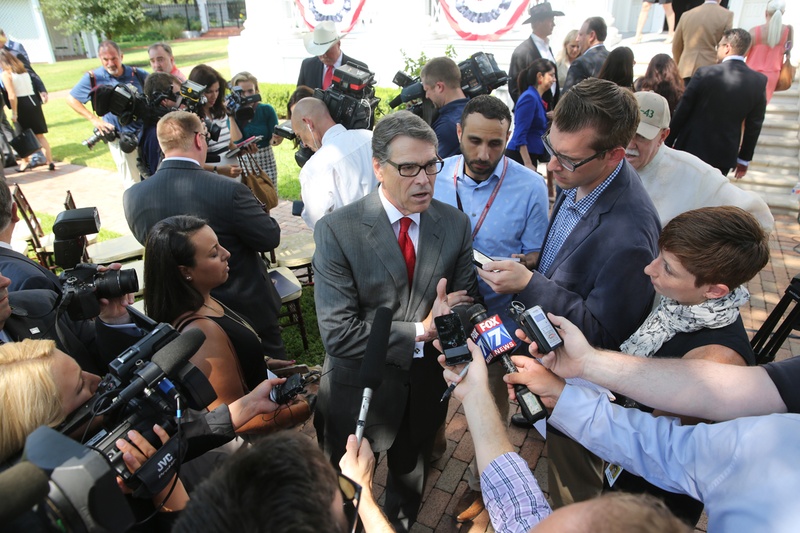 Perry in front of reporters