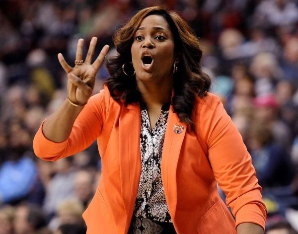 Dawn Brown holds up four fingers 