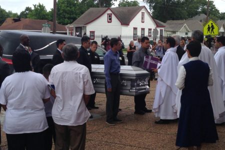 The pallbearers were greeted by a priest before entering the Holy Name Catholic Church, located north of downtown Houston.