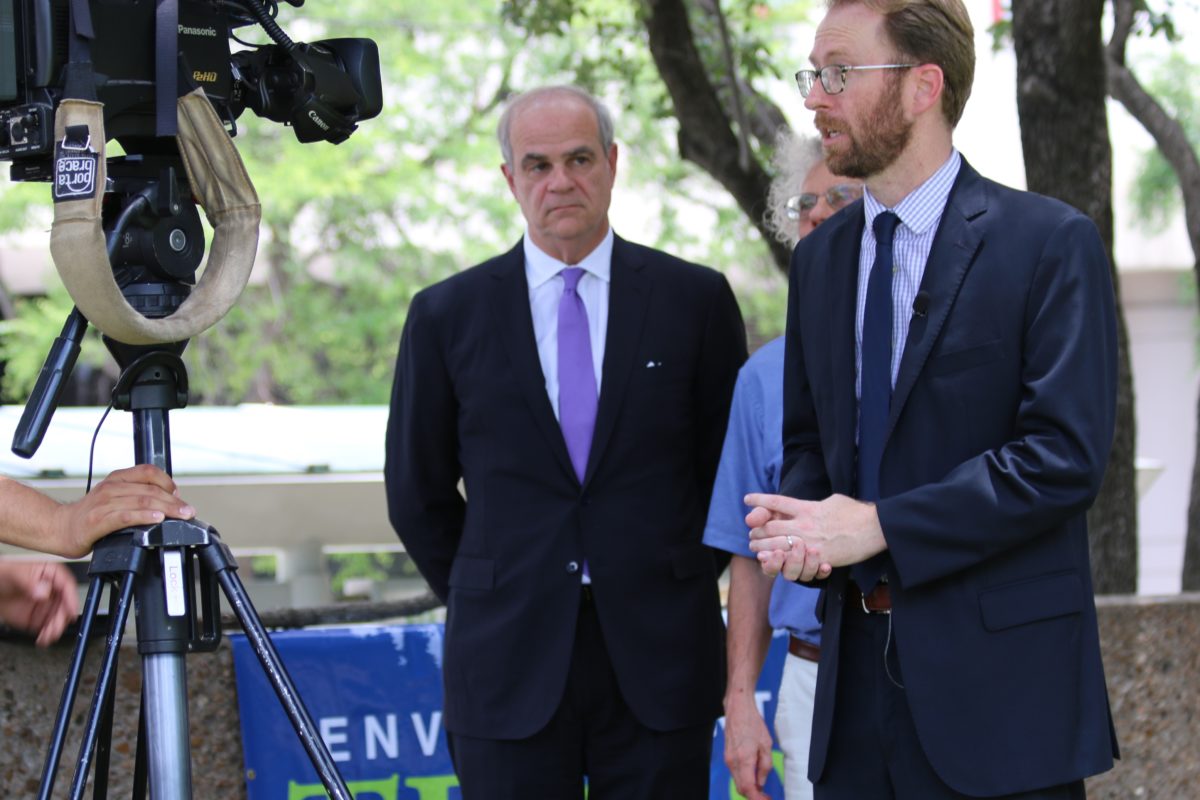 Luke Metzger with Environment Texas talks to reporters. To his right are attorney Phil Hilder and Sierra Club's Neil Carman