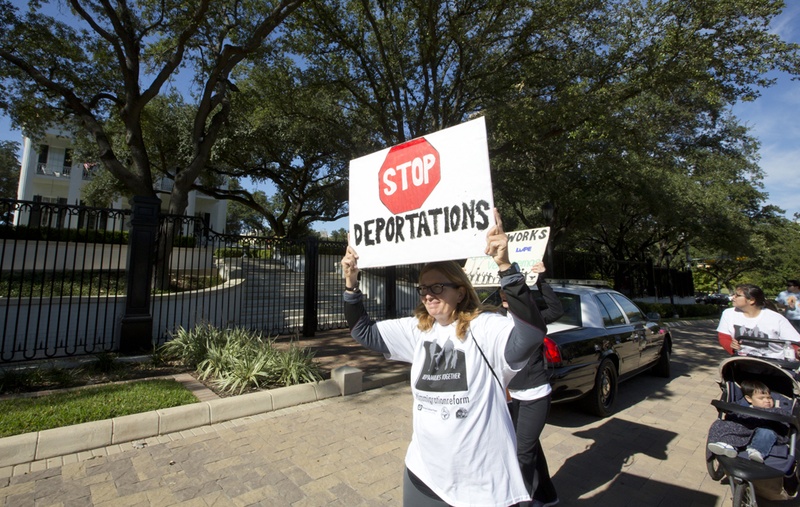 protest sign reads stop deportations