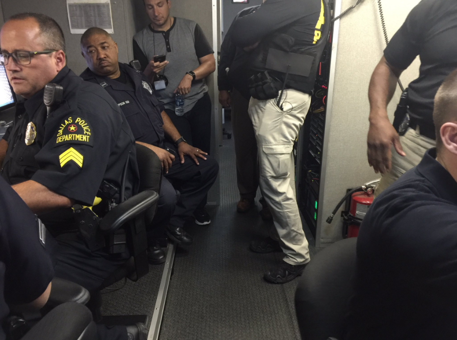 Dallas police in a command post dealing with the aftermath of a mass shooting that killed at least five officers.