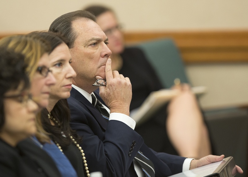 Texas Department of Family and Protective Services Commissioner Henry "Hank" Whitman waits to testify during a October 26, 2016 Senate Finance Committee hearing.  