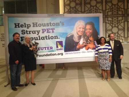 Alan Ratliff, chair and president of Houston BARC Foundation, Council Member Karla Cisneros –who is holding Otto— Ashley Turner, Mayor Sylvester Turner’s daughter and Lee Vela, vice president of Public Affairs of Clear Channel Outdoor pose next to the campaign’s billboard.