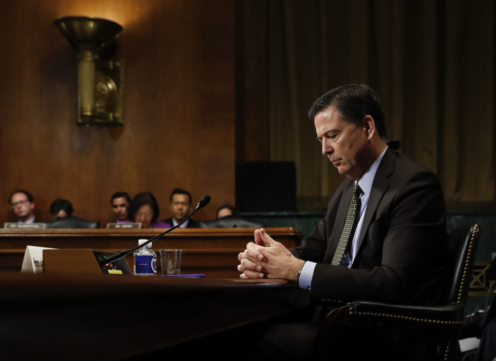 In this Wednesday, May 3, 2017, photo then-FBI Director James Comey pauses as he testifies on Capitol Hill in Washington, before a Senate Judiciary Committee hearing. President Donald Trump abruptly fired Comey on May 9, ousting the nation's top law enforcement official in the midst of an investigation into whether Trump's campaign had ties to Russia's election meddling.