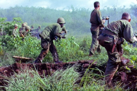 Dak To, South Vietnam. An infantry patrol moves up to assault the last Viet Cong position after an attempted overrun of the artillery position by the Viet Cong during Operation Hawthorne.
