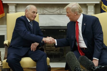 President Donald Trump talks with new White House Chief of Staff John Kelly after he was privately sworn in during a ceremony in the Oval Office with President Donald Trump, Monday, July 31, 2017, in Washington.
