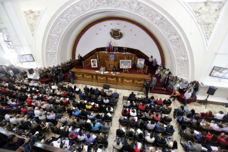 Constitutional Assembly delegate Carmen Melendez speaks from the podium during a session in Caracas, Venezuela, Tuesday, Aug. 8, 2017. The government-backed assembly that is recasting Venezuela's political system filed into the stately domed chamber where congress normally meets. In two previous sessions, the 545-member assembly met in an adjacent, smaller building.