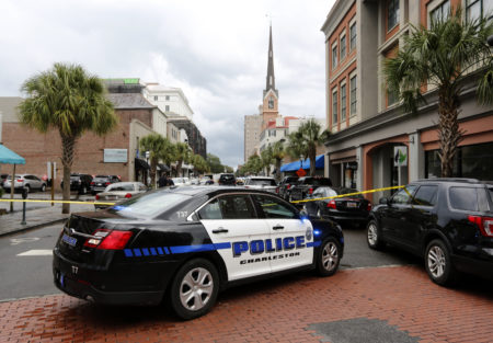 Charleston, S.C. Police Department block access to King Street in front of the restaurant Virginia's on King in Charleston, S.C.,Thursday, Aug. 24, 2017. A disgruntled employee shot a gun in the restaurant and a hostage situation happened after the shooting. Charleston Mayor John Tecklenburg says the hostage situation has ended with the gunman being shot by police.