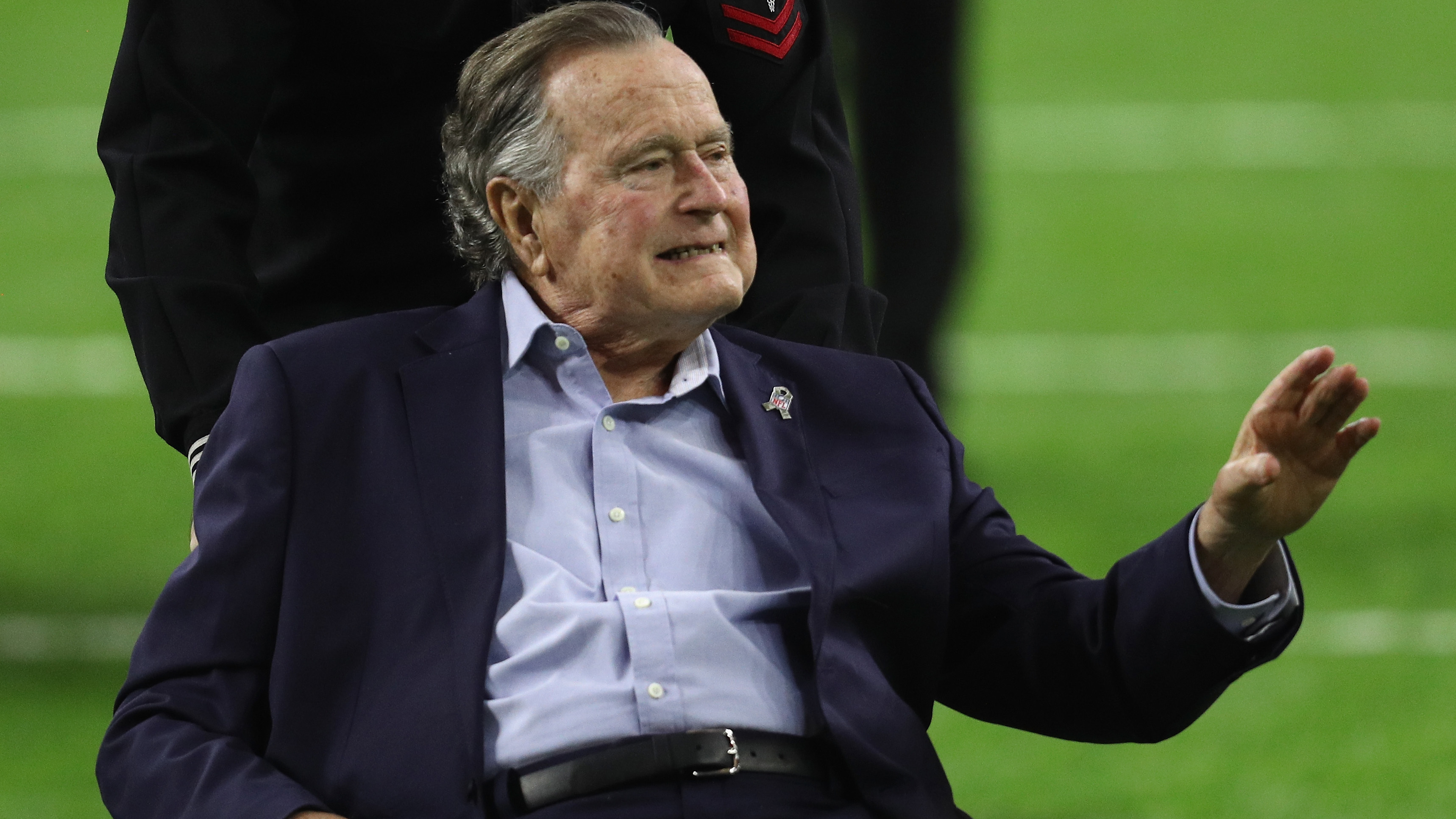 Former President George H.W. Bush arrives for the coin toss for the 2017 Super Bowl in Houston.