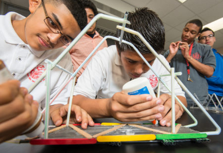 Students work on bridges at Furr High School, September 18, 2014.
