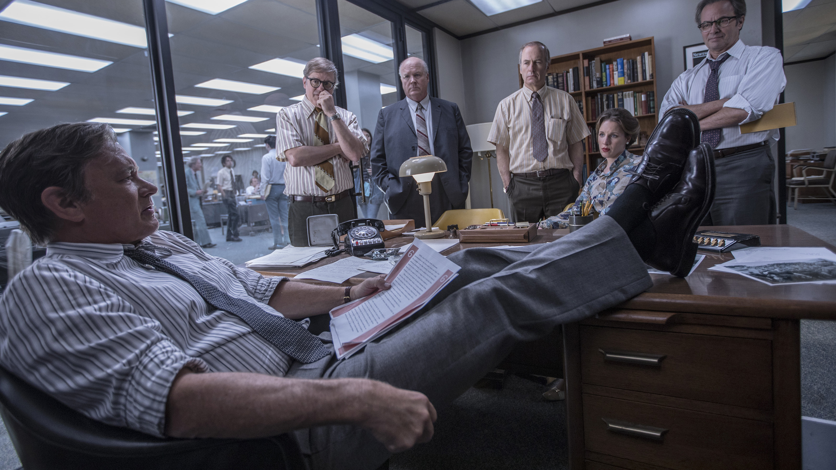 Steven Spielberg's The Post stars Tom Hanks as Washington Post editor-in-chief Ben Bradlee. (Also pictured: David Cross, John Rue, Bob Odenkirk, Jessie Mueller and Philip Casnoff.)