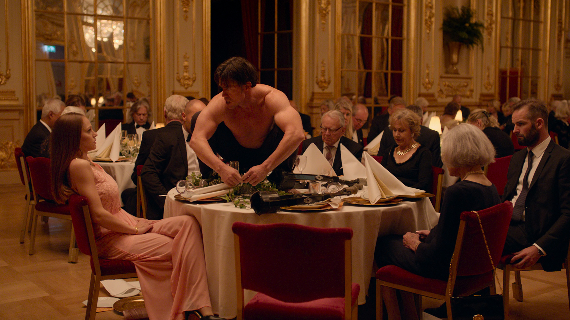 A performance artist (Terry Notary) practices his craft at a black-tie event in the arts-world satire The Square.