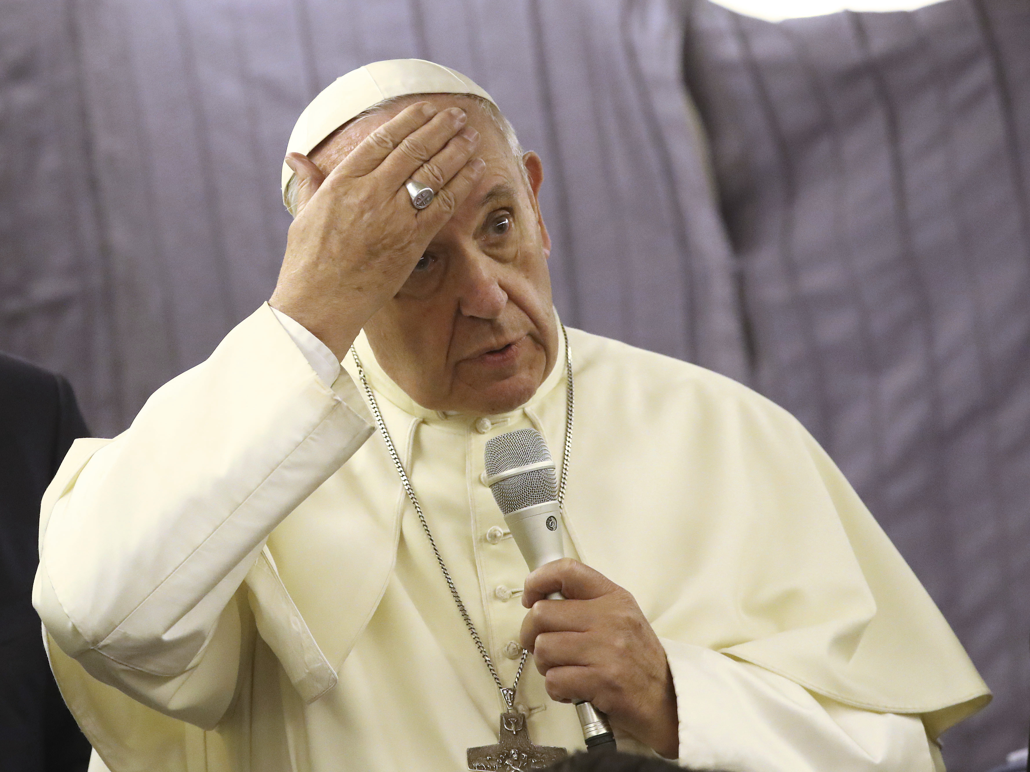 Pope Francis apologizes to sexual abuse victims onboard his flight from Lima, Peru, to Rome on Sunday.