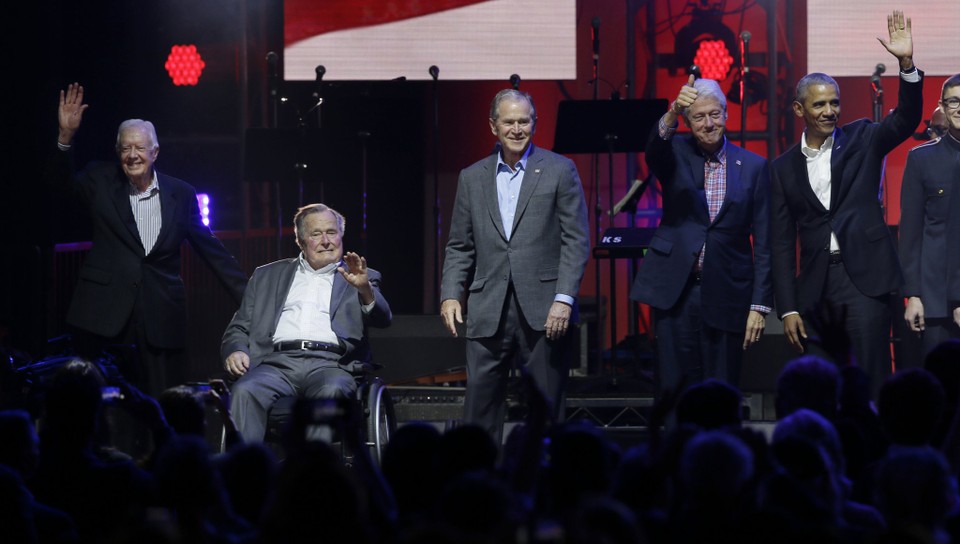 In this Oct. 21, 2017, file photo, former Presidents, from left, Jimmy Carter, George H.W. Bush, George W. Bush, Bill Clinton and Barack Obama during a hurricane relief concert in College Station, Texas.