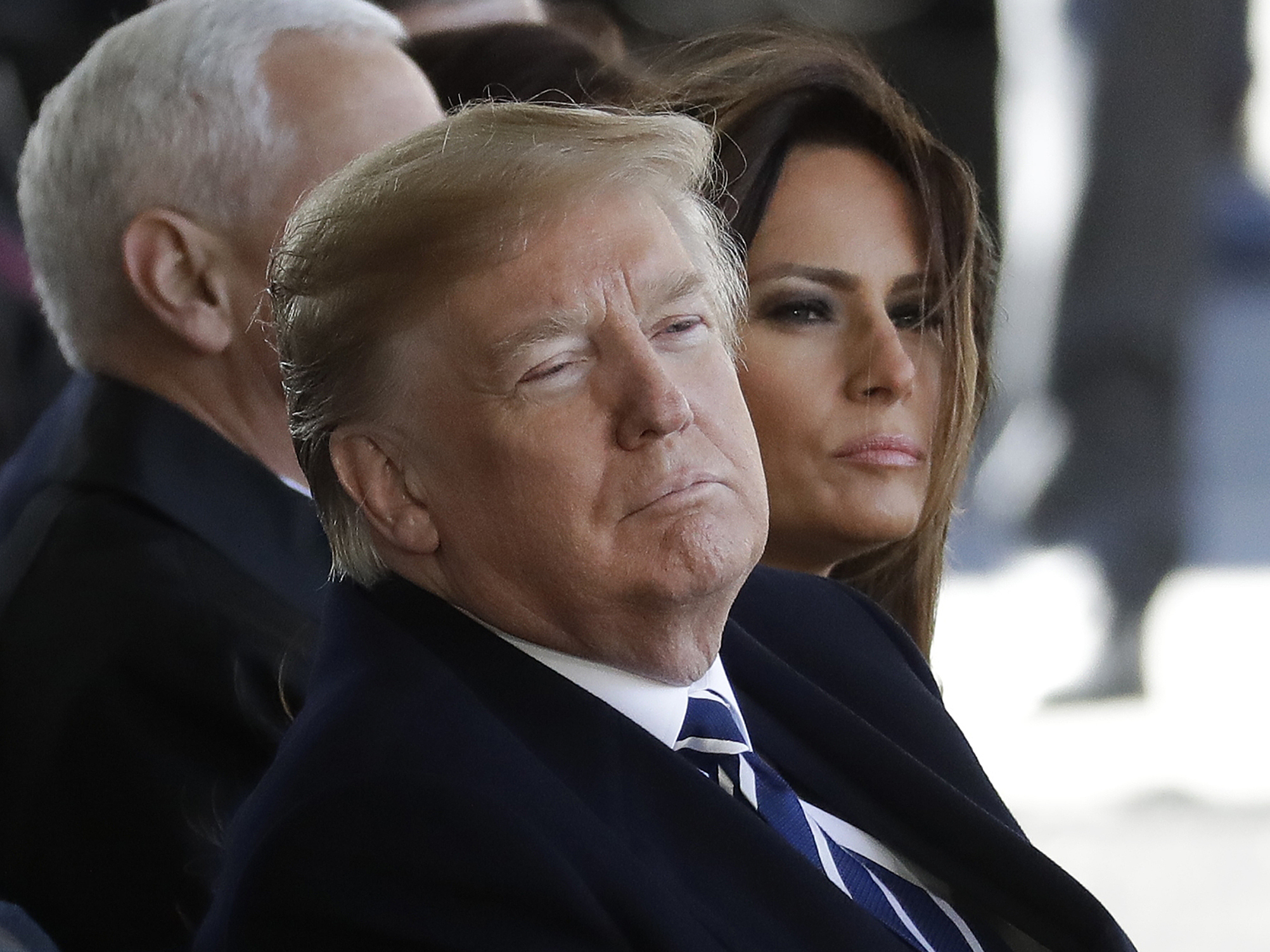 President Trump and First lady Melania Trump listen to a sermon during a funeral service for the Rev. Billy Graham on Friday.
