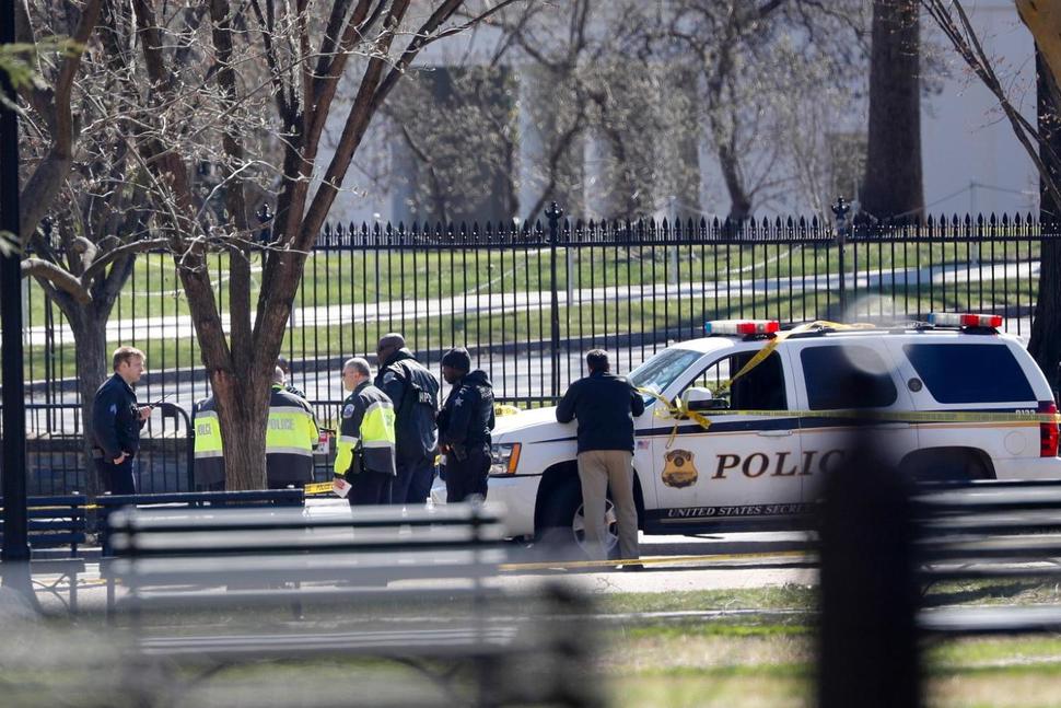 Law enforcement officers gather infront of the White House in Washington, Saturday, March 3, 2018. 