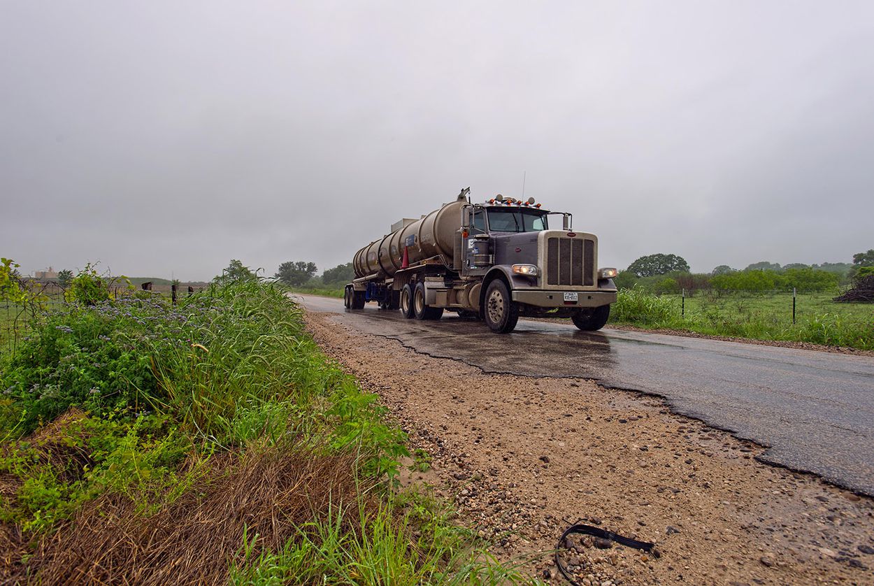 A tanker truck travels on FM 2067 between Austin and Victoria on April 18, 2018. Texas counties are asking state leaders to help pay for road damage caused by heavy traffic from the oil and gas industry.