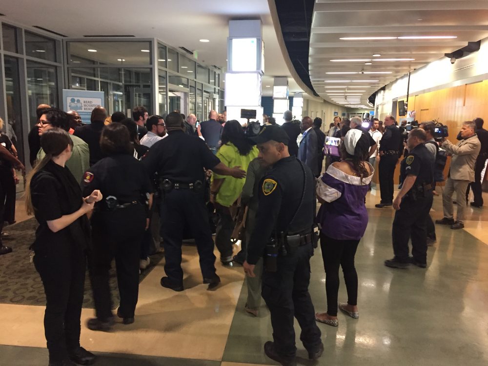 About 100 people were removed from the HISD auditorium after a scuffle with police officers and a protest ensued. The heated meeting was meant to consider a charter partnership for 10 schools, but ended without a vote.