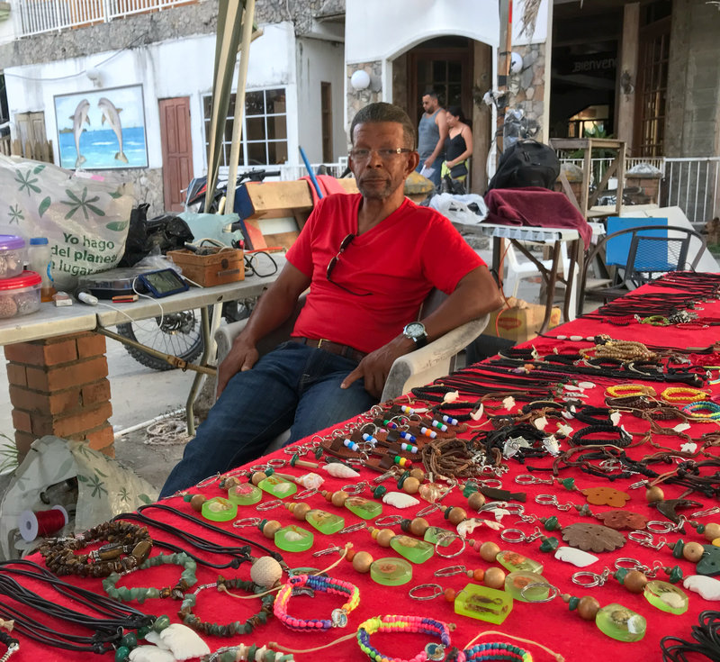 Harold James Tatum was deported to Honduras 18 years ago. He says he's never really gotten used to it — or found steady work. He now sells jewelry by the beach but says he doesn't make enough to live on.
