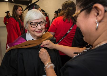 Bertie Simmons gets ready before the Furr / Reach High School graduation in Delmar Fieldhouse, May 26, 2017. The ceremony was the first graduation to be held in the newly constructed facility.