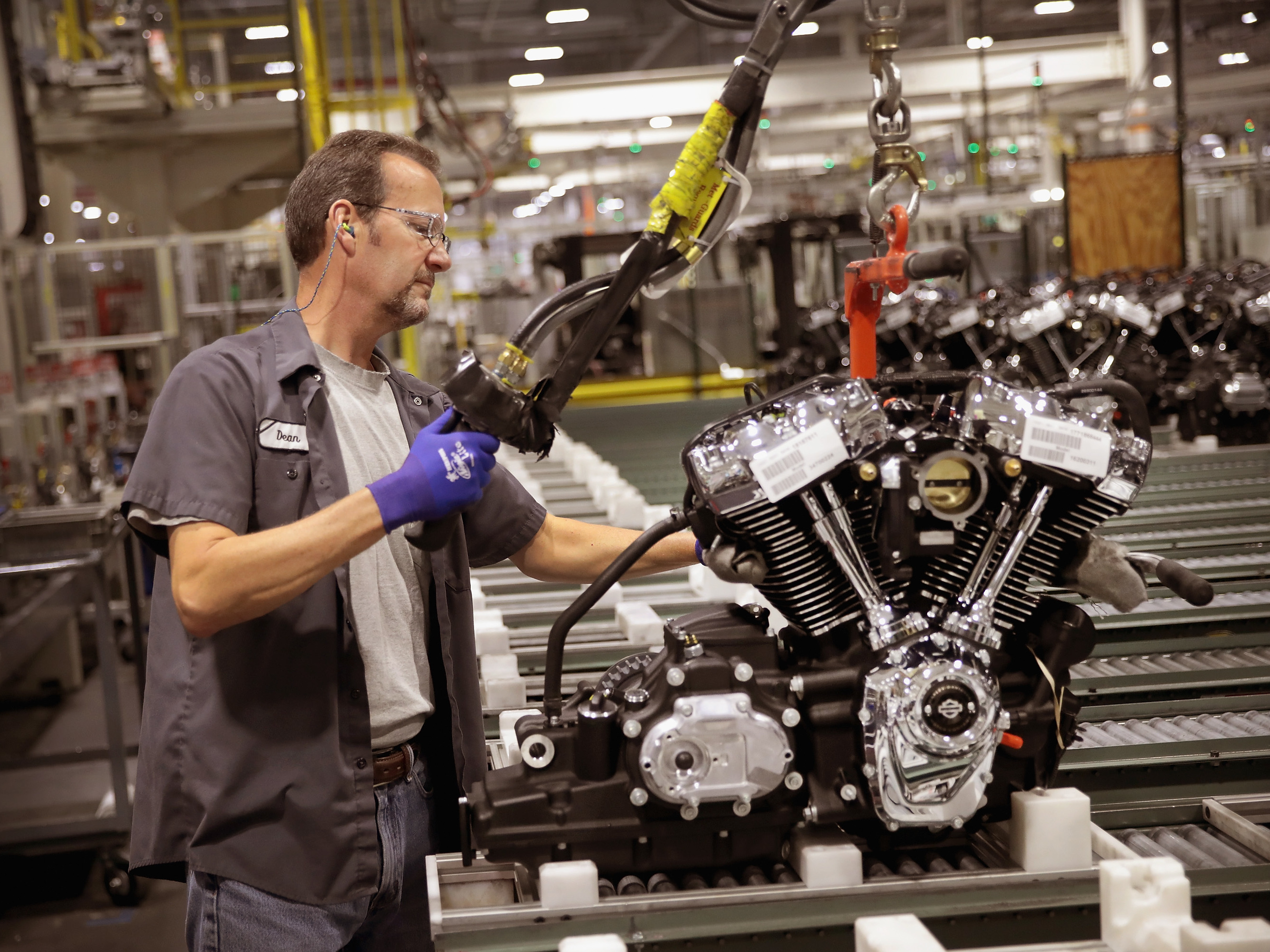 Harley-Davidson motorcycle engines are assembled at the company's plant in Menomonee Falls, Wis. Tariffs from the European Union are prompting the company to shift production of some motorcycles for the European market overseas.