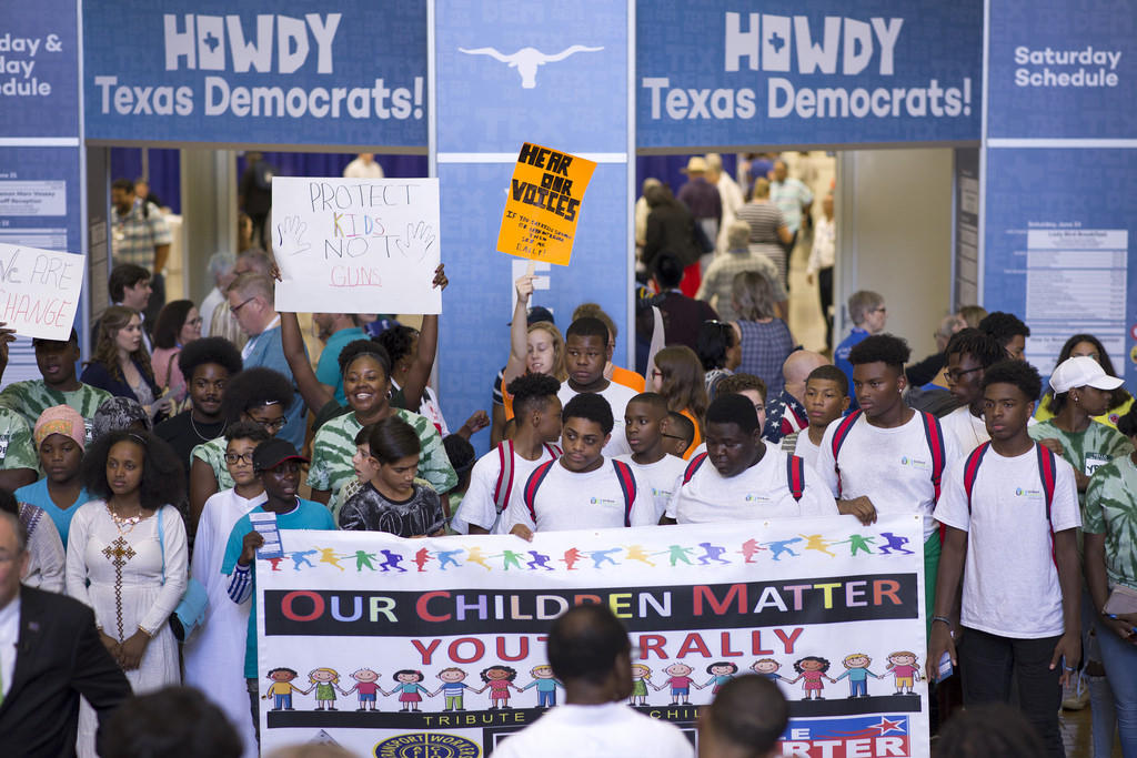 Student activists from March for Our Lives Houston march the halls of the convention center at the 2018 Texas Democratic Convention in Fort Worth, Texas, on June 22, 2018.
