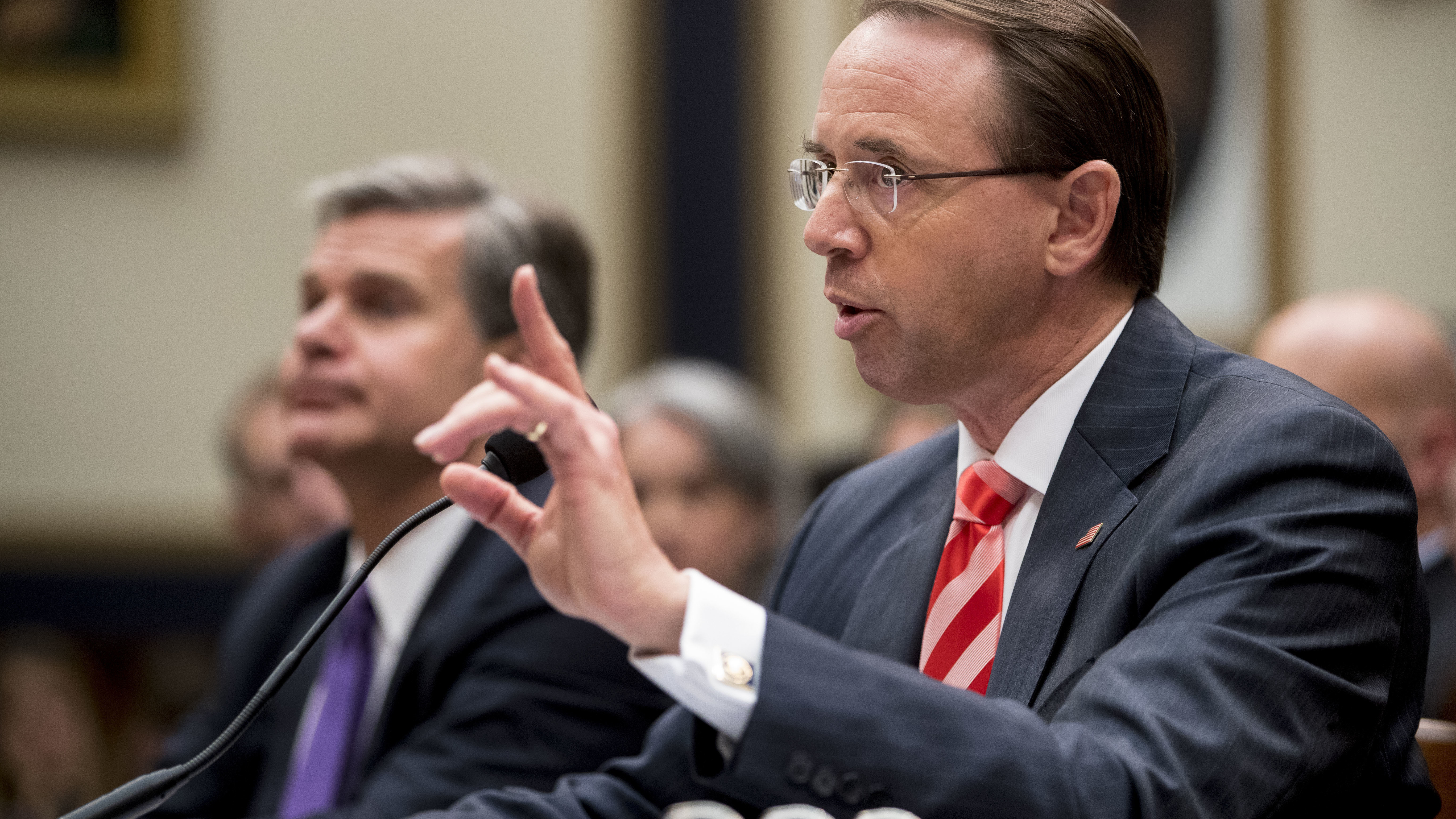 Deputy Attorney General Rod Rosenstein told lawmakers Thursday that he objected to personal attacks about purported Justice Department stonewalling on the Russia investigation. With him is FBI Director Christopher Wray.
