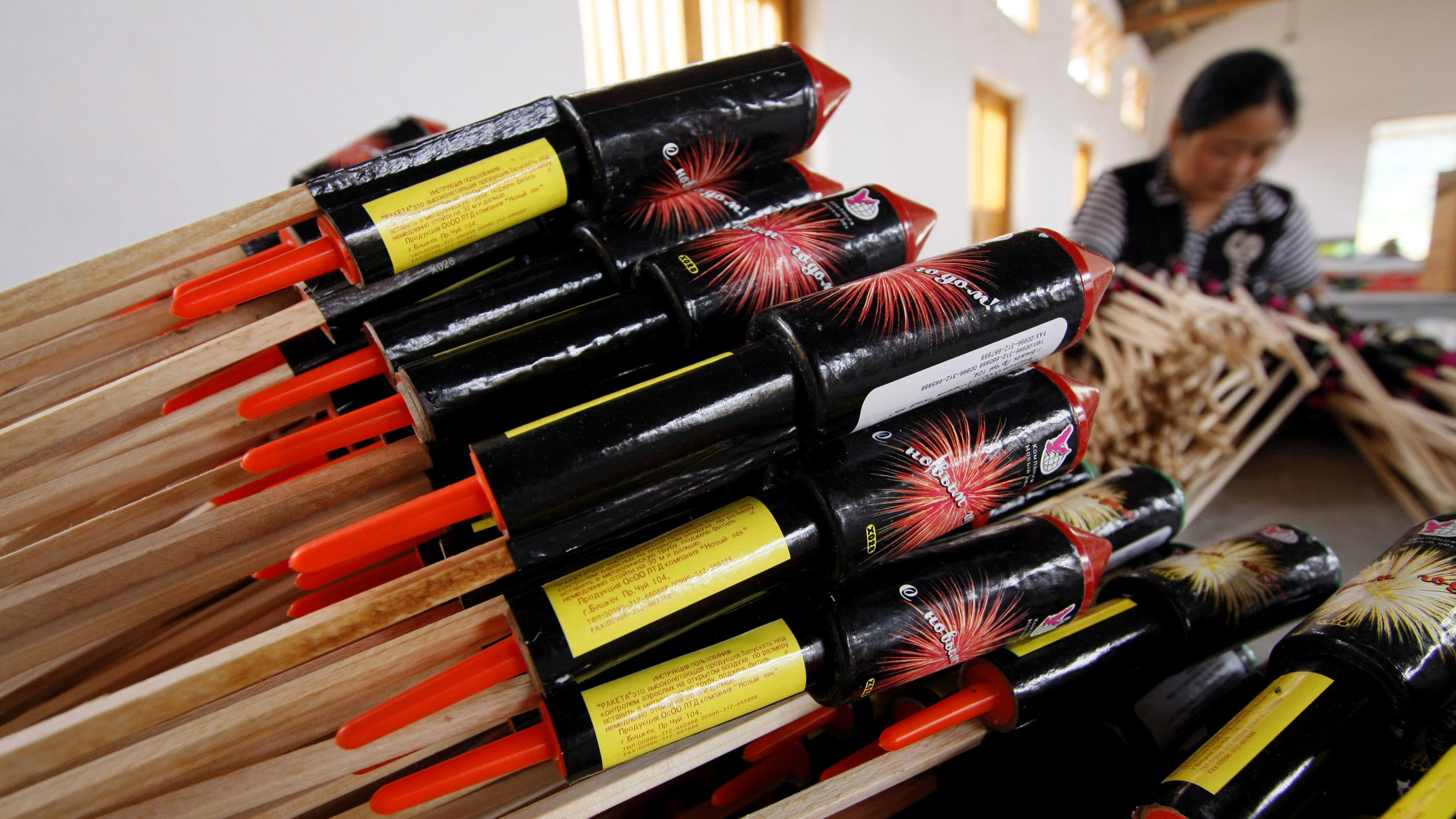 A worker assembles parts of a rocket firework at Southern Fireworks Manufacturer's factory in in 2008 in Liuyang, China, in Hunan province, Thursday June 19, 2008. Most American fireworks are imported from China. (AP Photo/Eugene Hoshiko)

