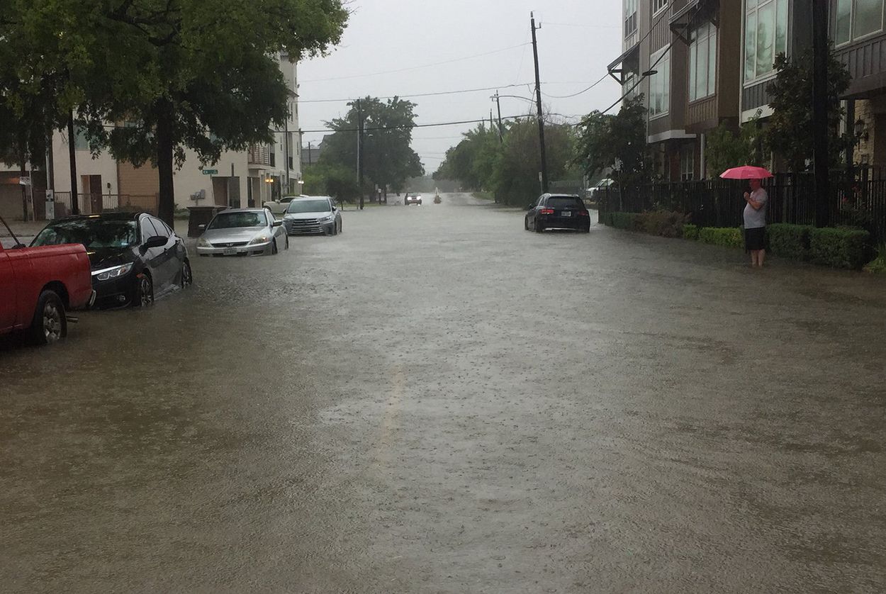 Streets flood in central Houston during heavy rain on July 4, 2018.  