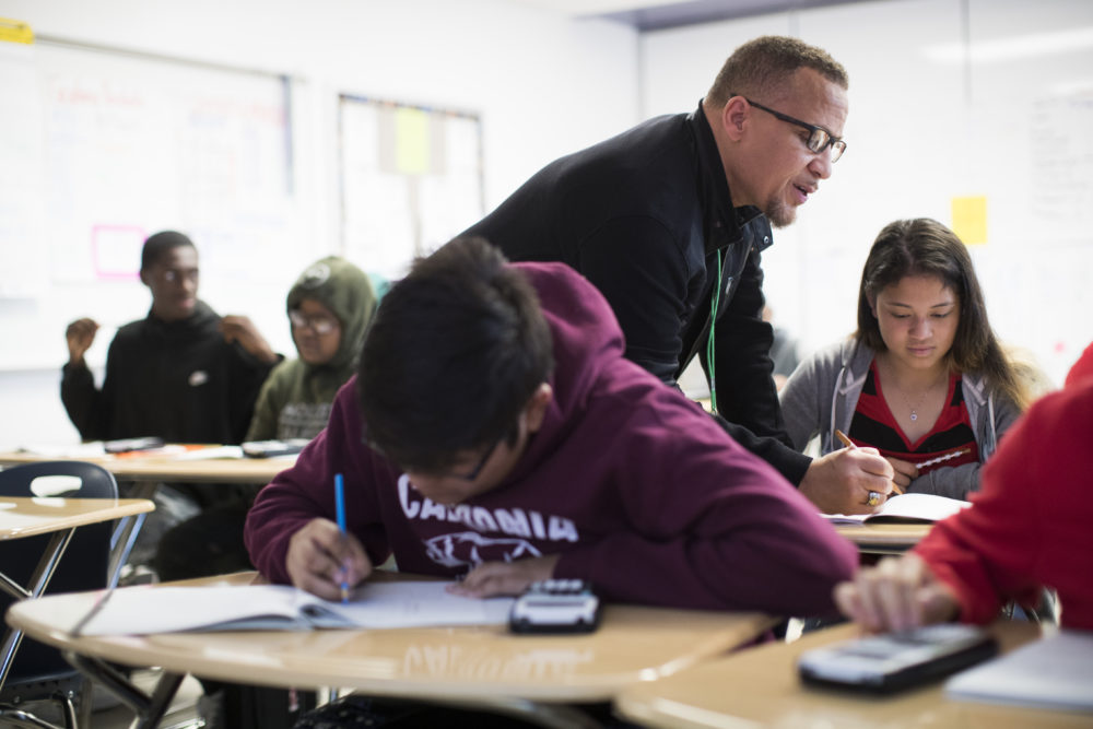 Worthing High School math teacher Michael Judge helps Hilda Martinez, 15, with questions during his Algebra I class on Thursday, April 5, 2018, in Houston. ( Marie D. De Jesus / Houston Chronicle )
