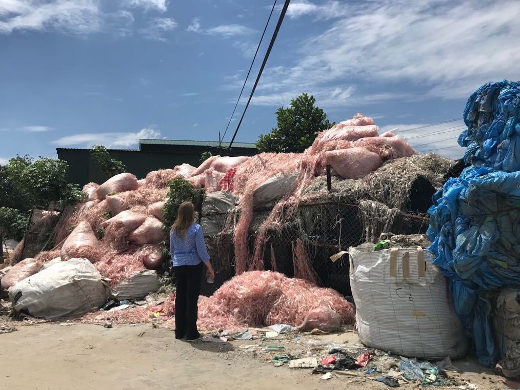 Waste engineer Jenna Jambeck of the University of Georgia surveys plastic waste in a southeast Asian village, where it will be recycled to make raw material for more plastic products. Jambeck advises Asian governments on how to keep plastic trash out of waterways.
