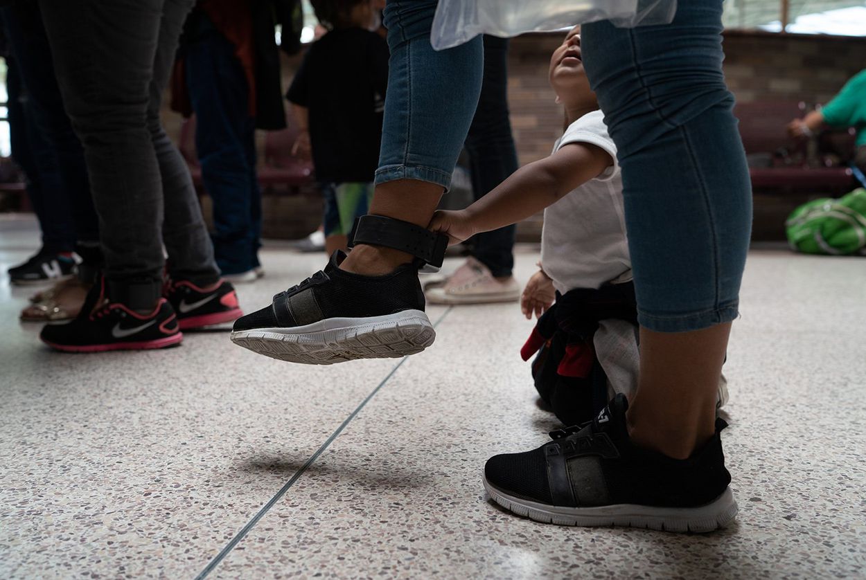 Central American asylum seekers wait at the bus station in McAllen to be taken to the Catholic Charities Humanitarian Respite Center on August 2, 2018.  