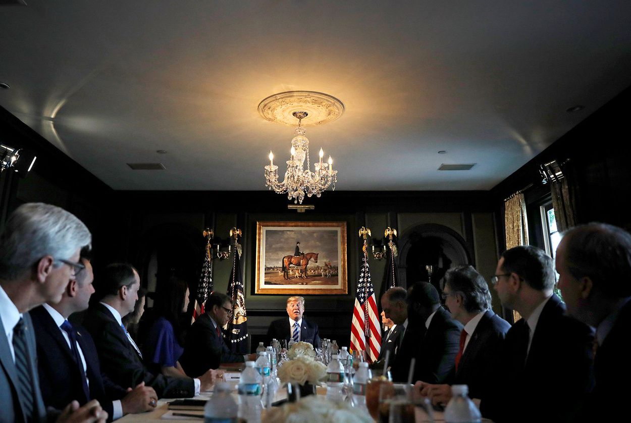 U.S. President Donald Trump participates in a roundtable discussion with state leaders (including Texas Attorney General Ken Paxton) on prison reform in Bedminster, New Jersey on August 9, 2018.  