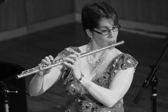 Black and white photo of flute player Meg Griffith